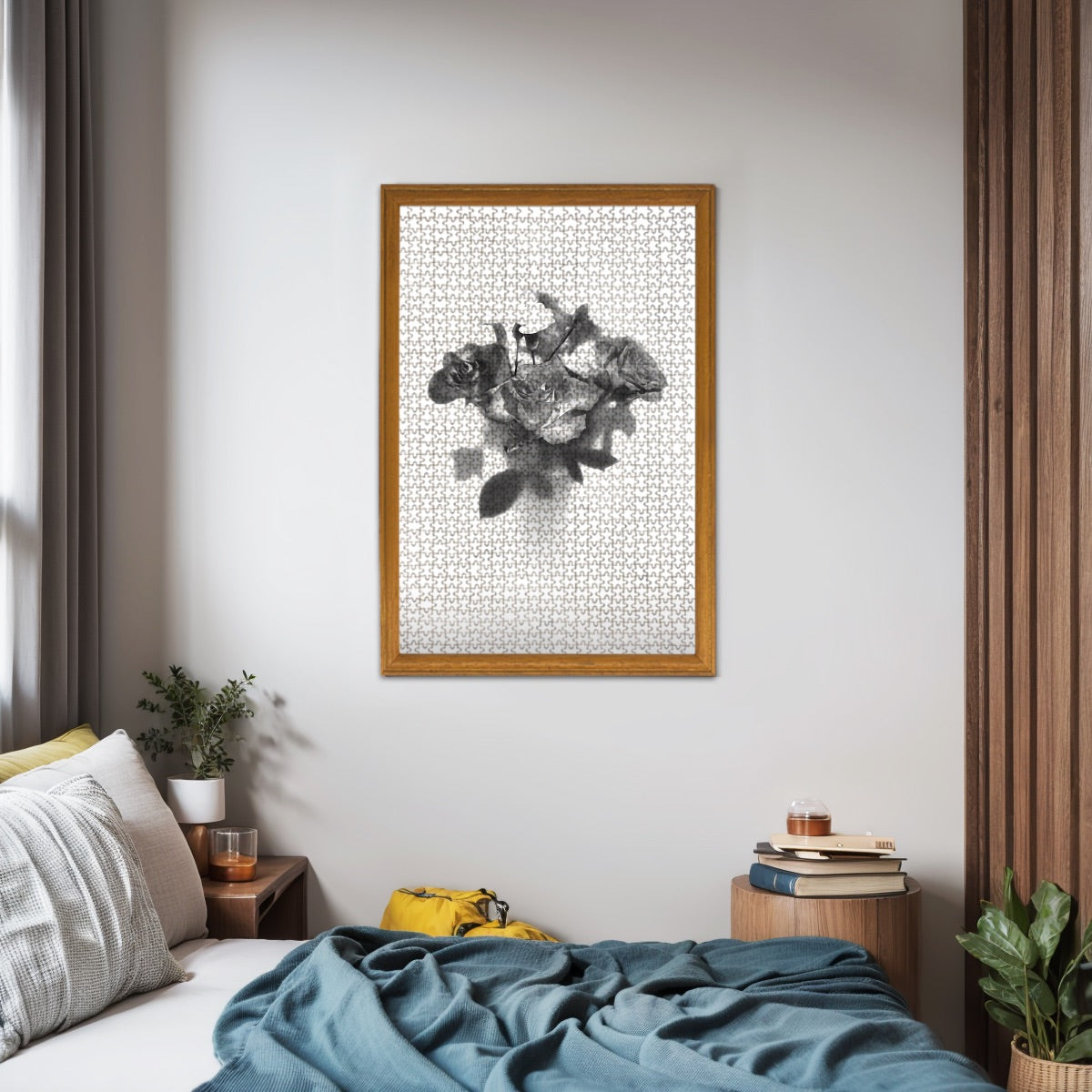 Living‑room mock‑up displaying the completed greyscale rose bouquet jigsaw puzzle framed above a sofa, illustrating finished size and monochrome elegance.