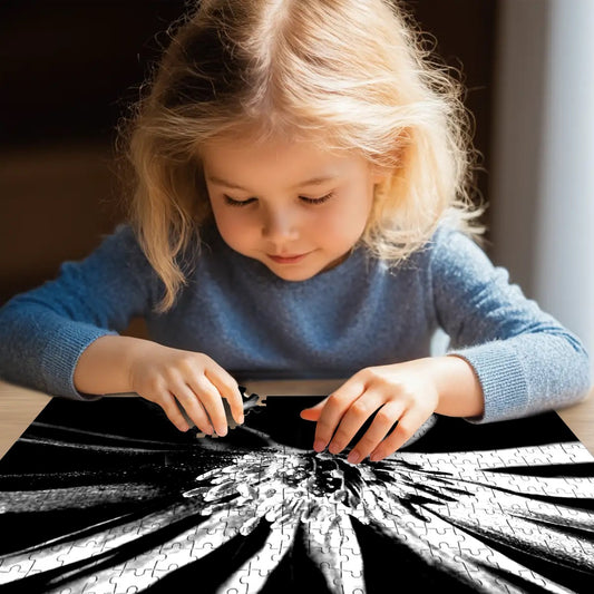 500-piece wooden jigsaw puzzle featuring a black and white close-up of a purple anemone, size 20.5" x 15"