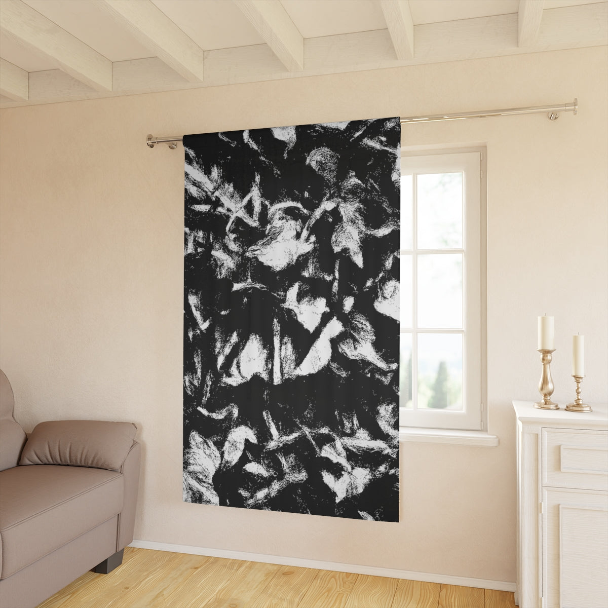 Black and white Leaf Tone curtain hanging in a sunlit interior, its bold contrasts adding structure to a soft, neutral-toned room