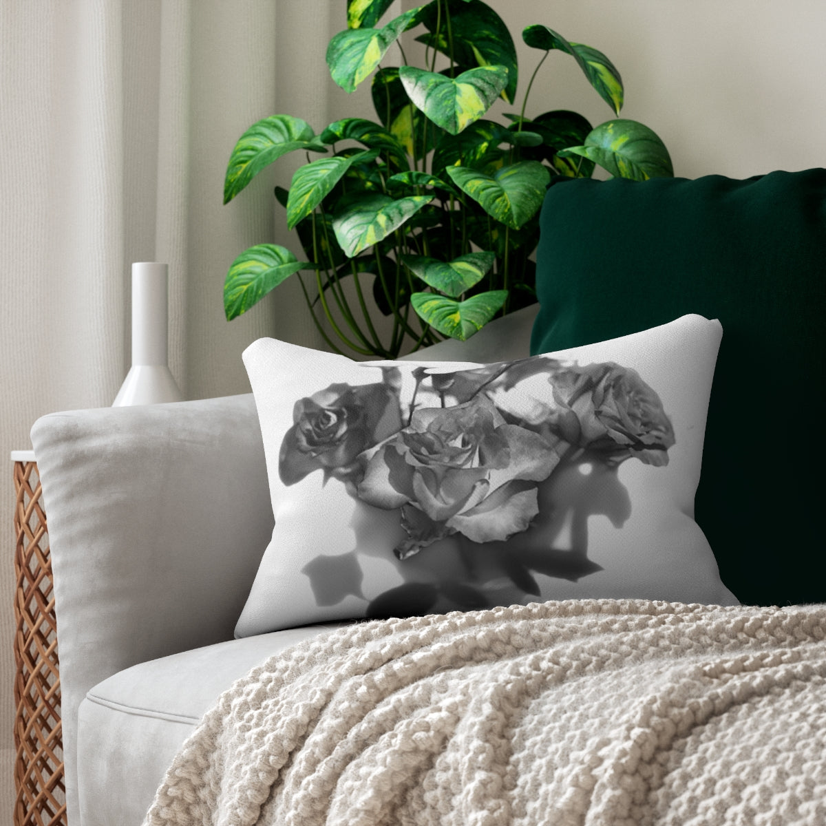 lumbar pillow featuring photograph of black and white roses
