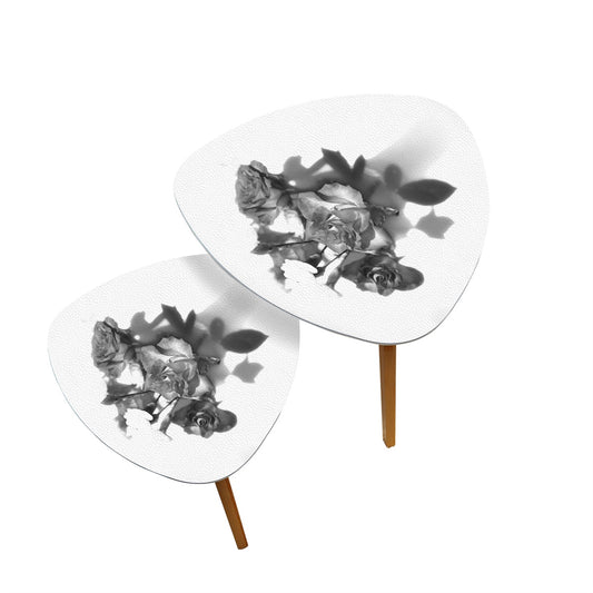 set of 2 black and white triangular coffee tables featuring bouquet of roses
