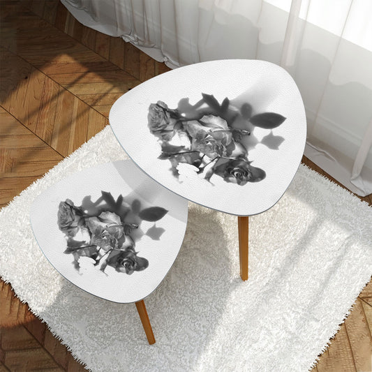 set of 2 black and white triangular coffee tables featuring bouquet of roses
