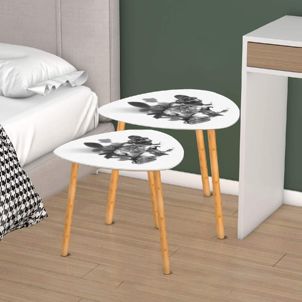 set of 2 black and white triangular coffee tables featuring bouquet of roses