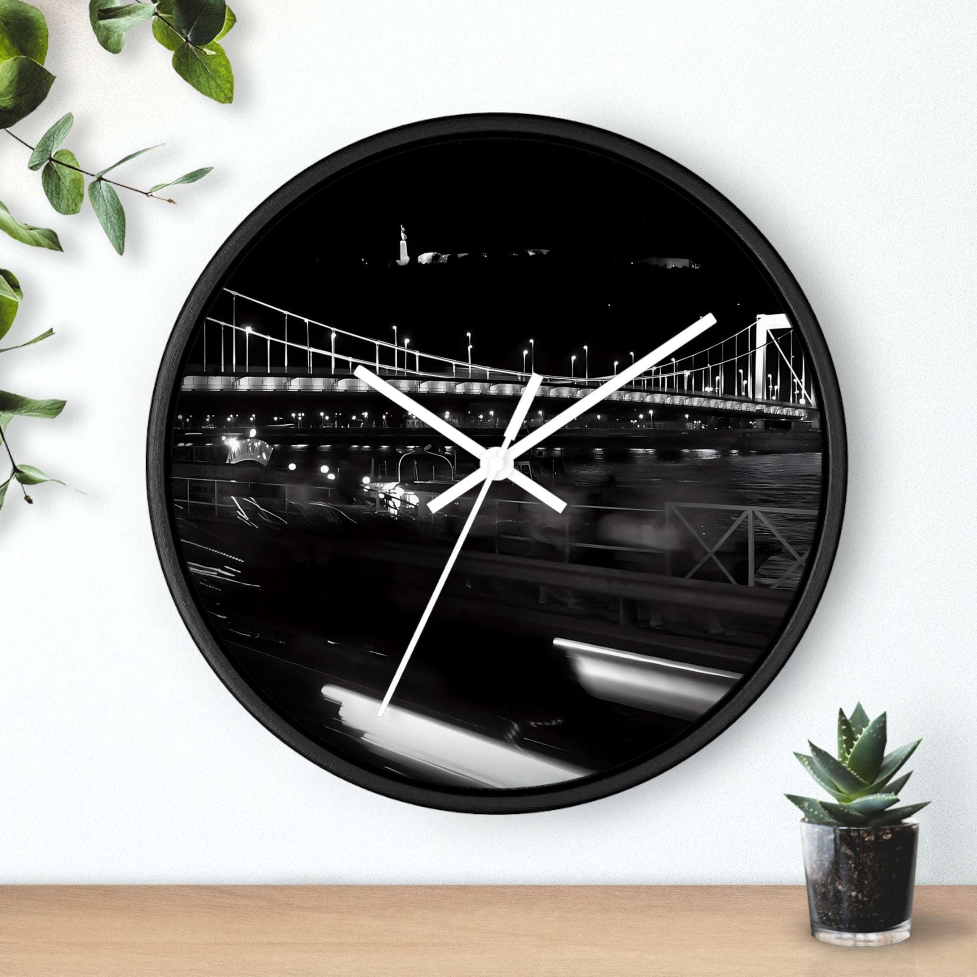 black and white wall clock featuring Budapest by night, bridge over Danube river, and Citadel, base: black: white, handles: white, size: 10''