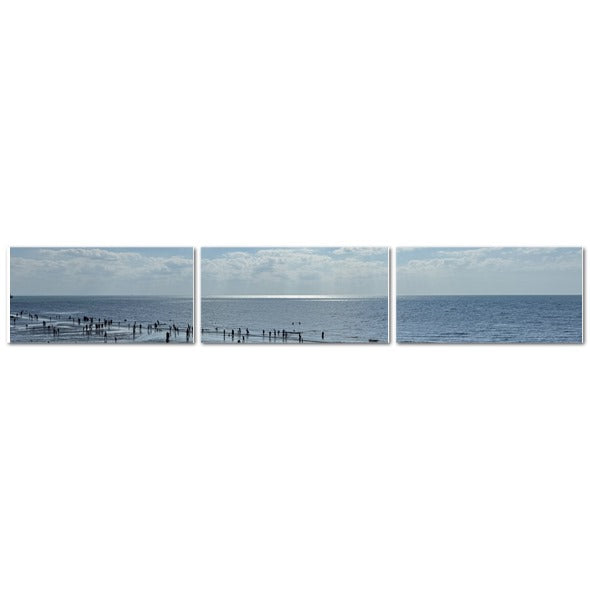 Made in UK Triptych Canvas featuring Beach in Shadow with Sunlight on the Horizon. three panel coastal scene with shadowed figures
