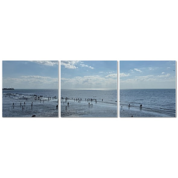 Made in UK Triptych Canvas featuring Beach in Shadow with Sunlight on the Horizon. Three panel beach scene with people on wet sand