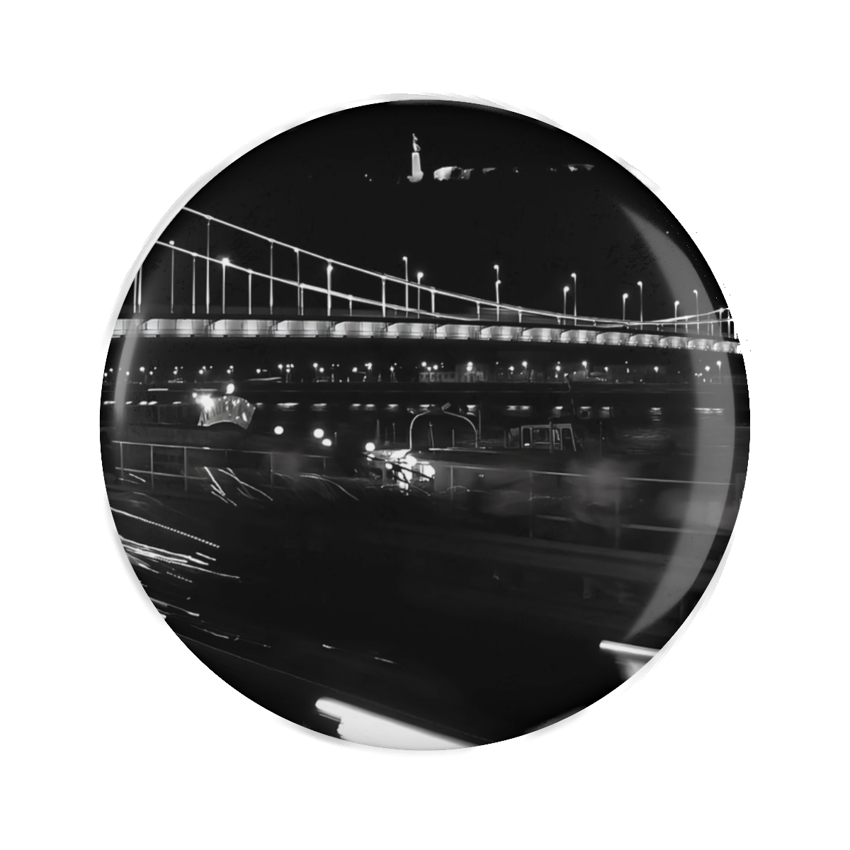 Fridge magnet featuring black and white long exposure photograph of bridge and citadel in Budapest with car and lights in bottom half