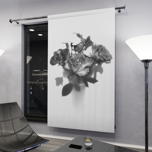 Curtain in evening setting: Grayscale rose blackout curtain in a modern room with floor lamps and city lights visible through a large window – 50" × 84".