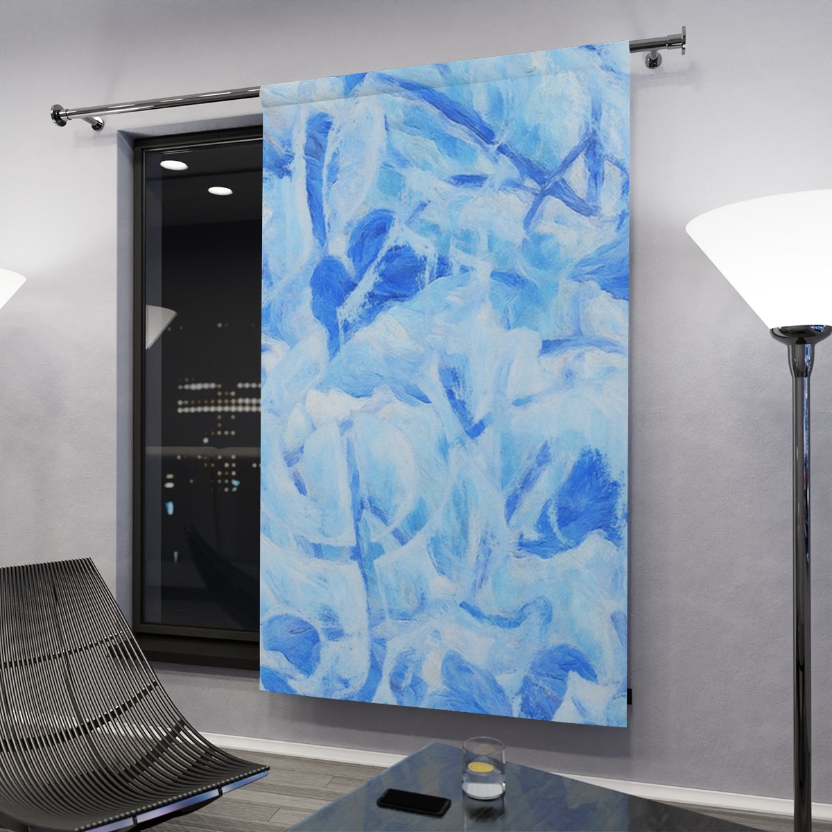 Cool blue with clef curtain variant with crisp leaf abstractions hanging in a contemporary nighttime space, gently illuminated by floor lamps