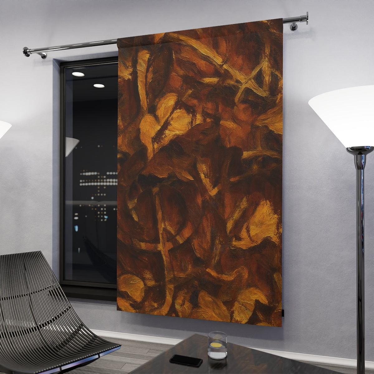 Original variant curtain with clef in brown and gold shades hanging in a modern nighttime interior with dark accents and city lights in the background