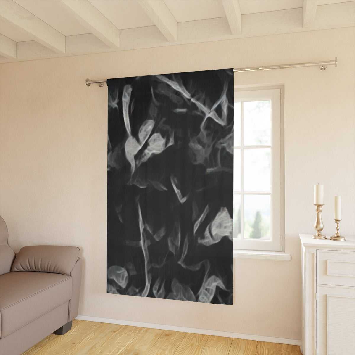 Sonata in Smoke blackout curtain with clef with ghostly white foliage shapes layered over black, adding dramatic depth to a softly lit contemporary room