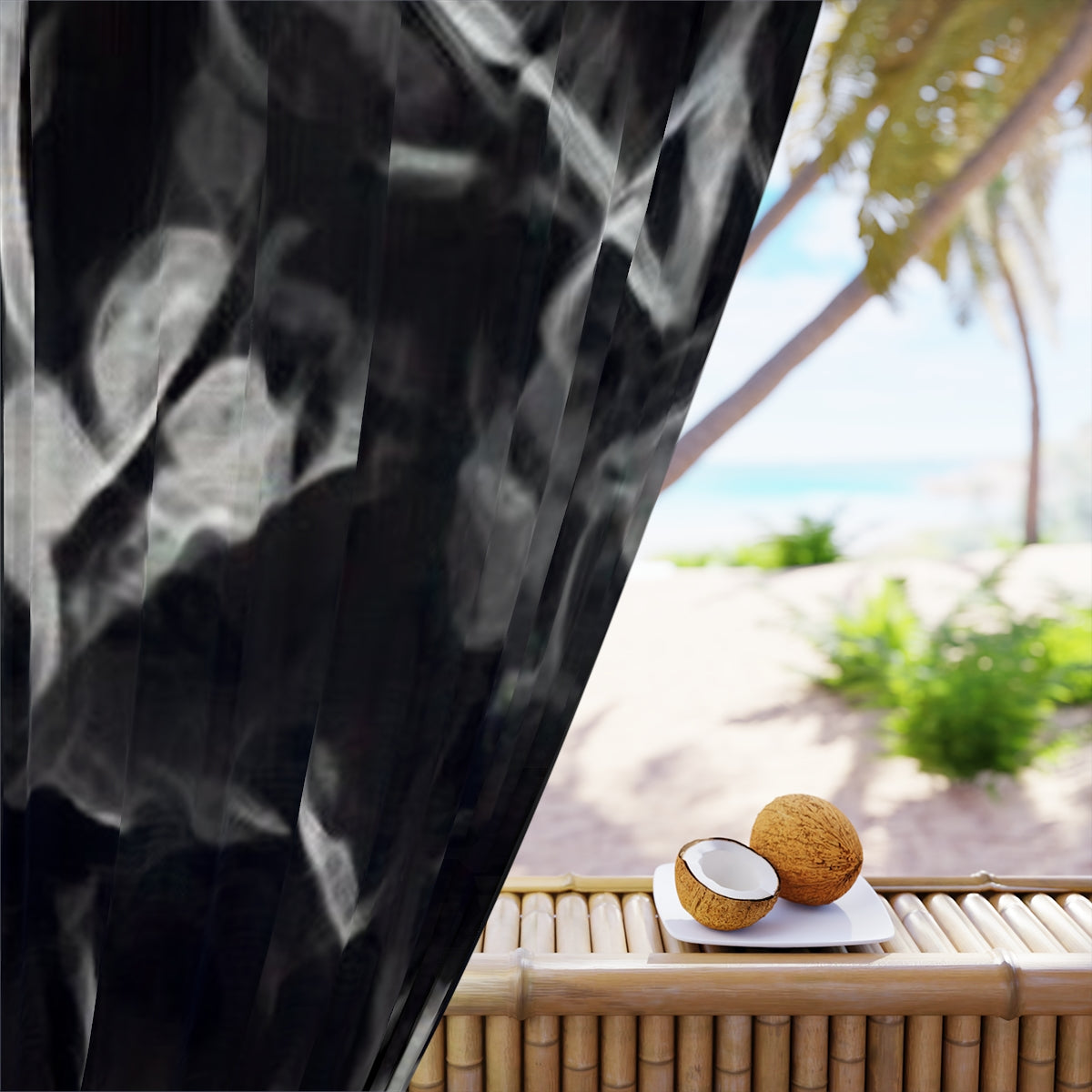 Close-up of blackout fabric showing soft white smoke-like outlines of abstract leaves emerging from a pitch-black background