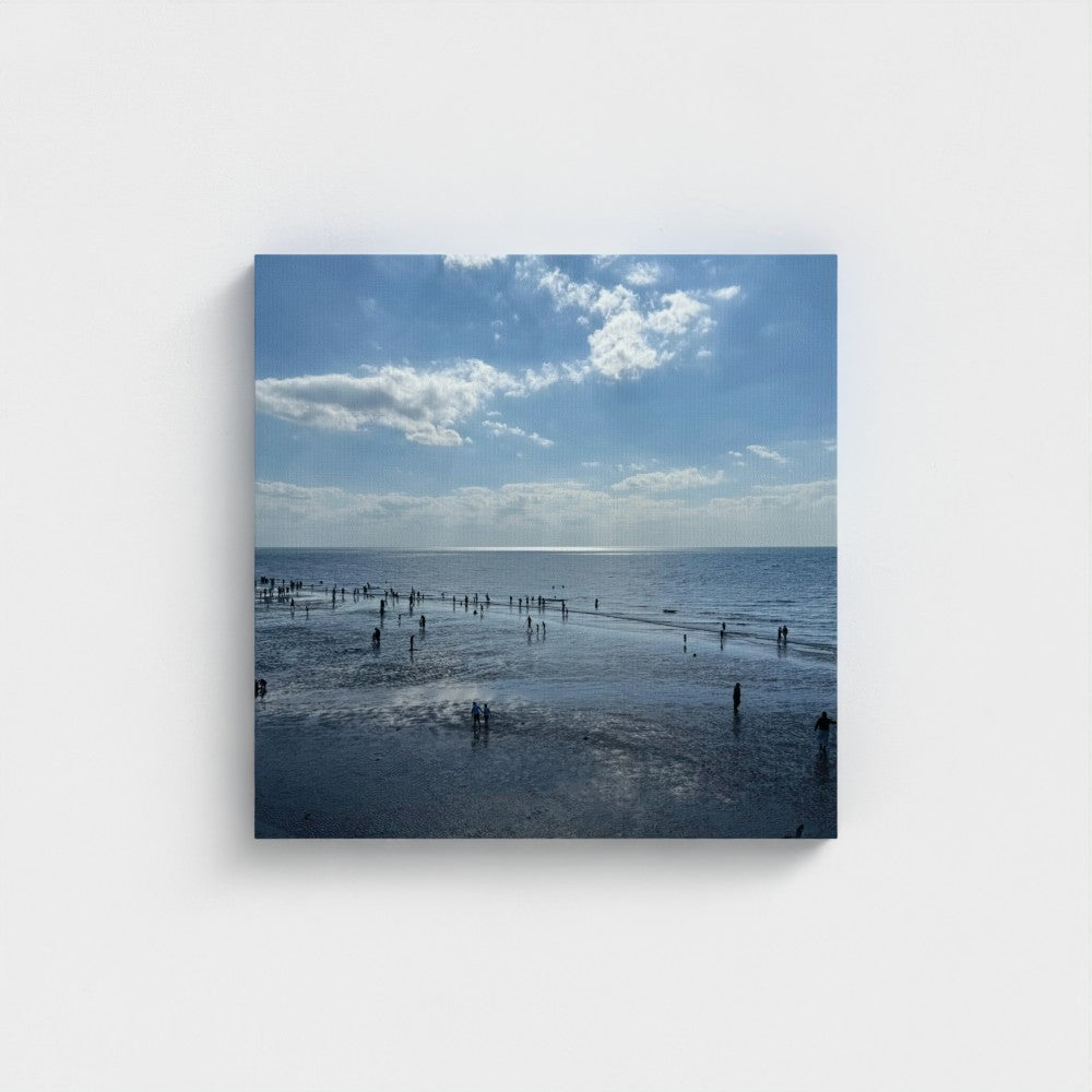 Made in UK Ec0-Friendly Canvas with Beach in Shadow and Sunlight on the Horizon. Papis Canvas print of low tide beach with people