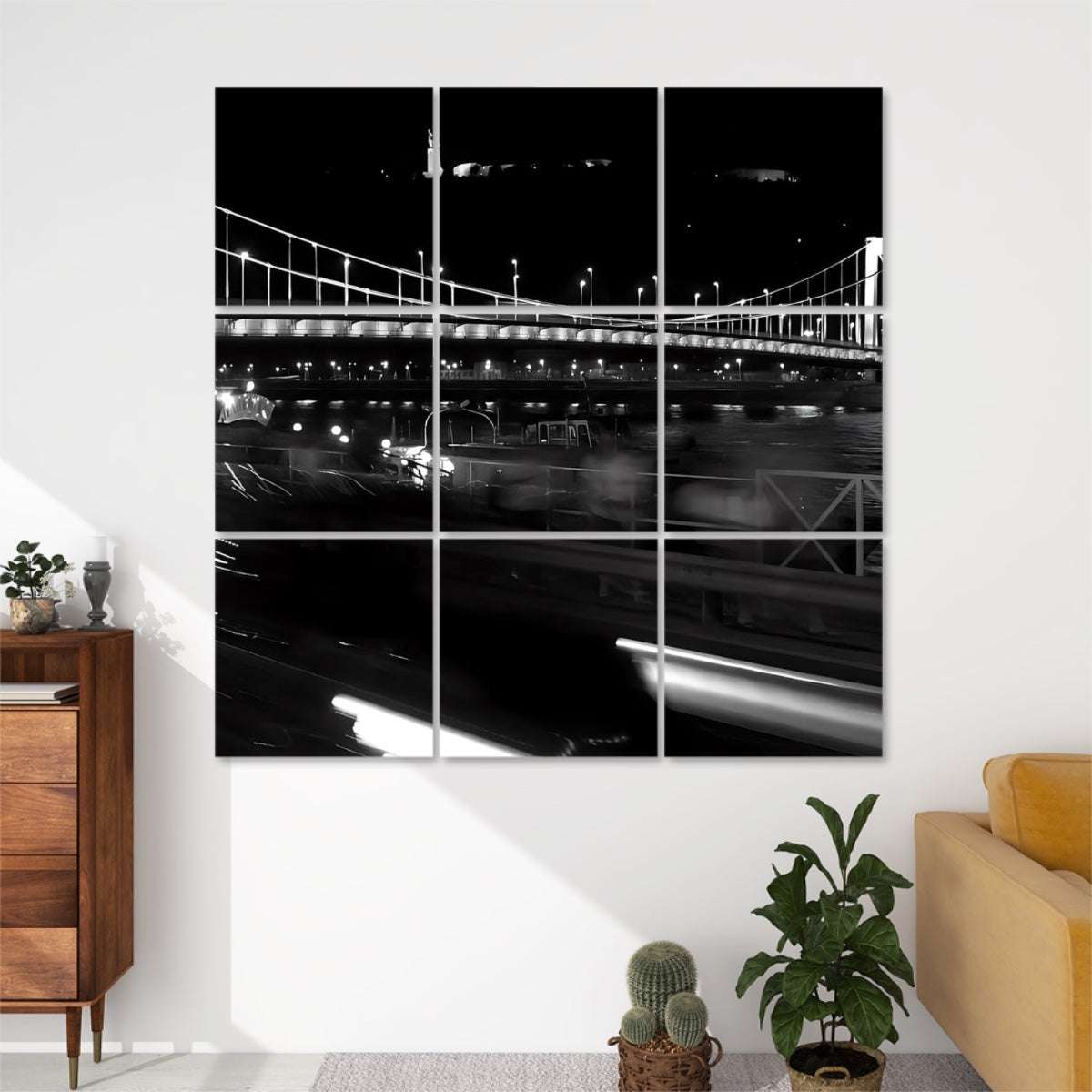 Night view of Elisabeth Bridge in Budapest with glowing streetlights, traffic light trails, and river reflections.