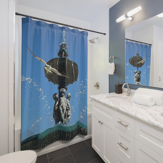 Designer shower curtain featuring seagull from Lisbon in flight with fountain in background, size 71’’x74’’