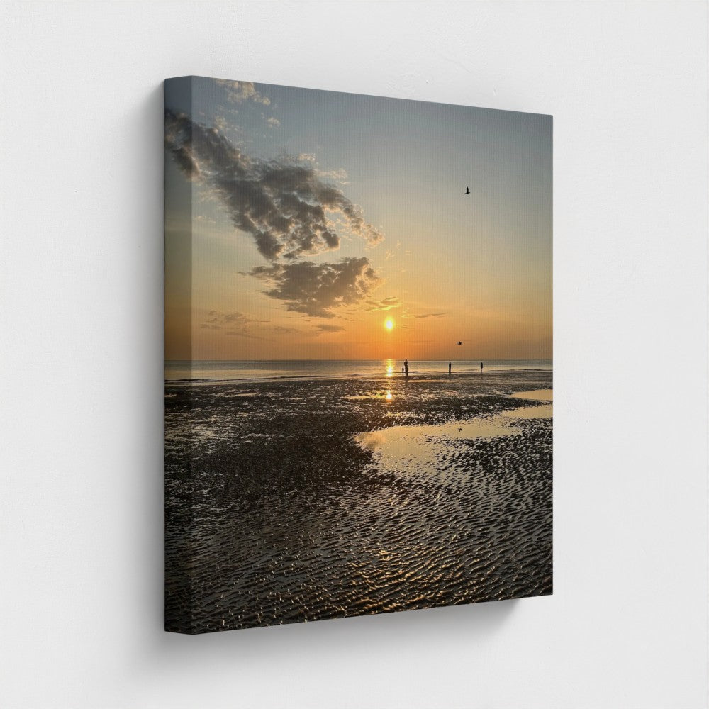 Sunset beach scene canvas print featuring a glowing sun over water and figures with Eco-Friendly Giclee