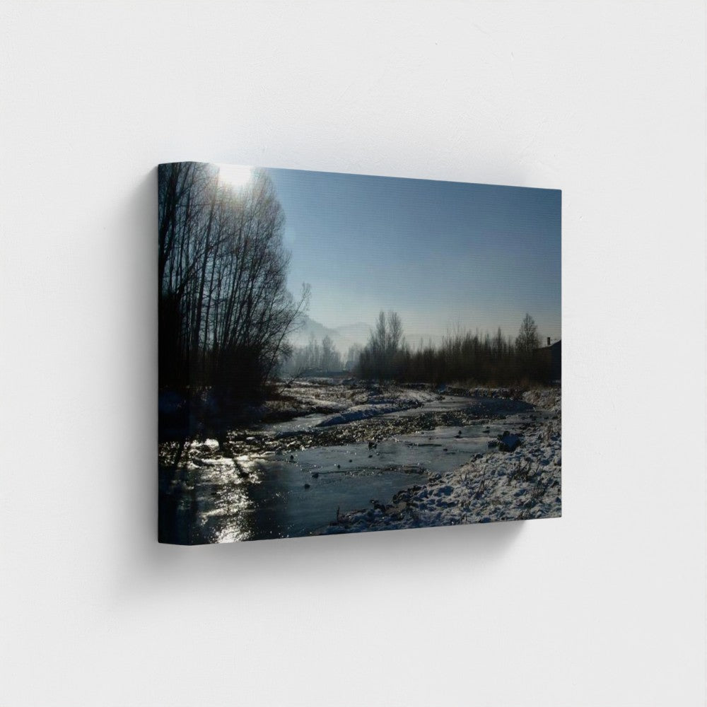 Papi's Canvas Eco-Friendly Landscape Wall Art featuring a river and forest in winter under clear blue sky