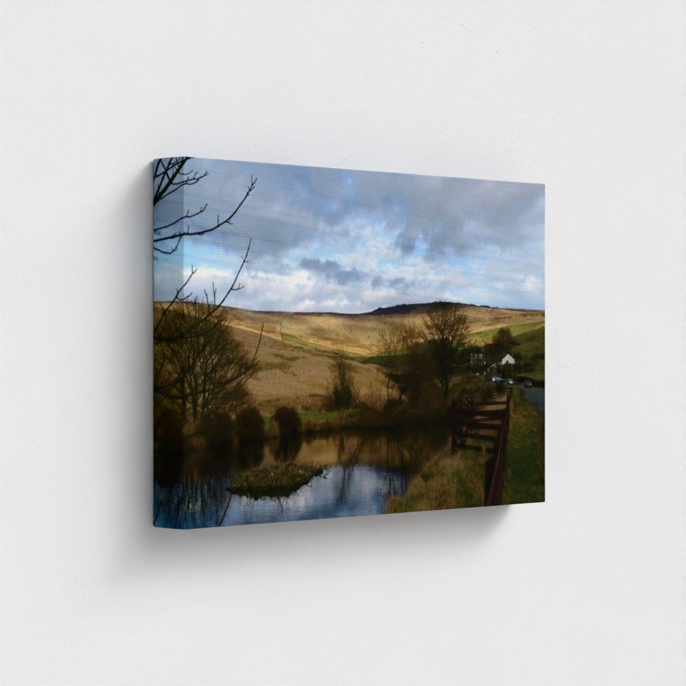 Papi's Canvas eco-friendly wall art featuring a serene rural landscape with a pond and rolling hills under a cloudy sky