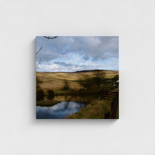Eco-Friendly Wall Art featuring a serene countryside landscape with a pond and rolling hills by Papi's Canvas