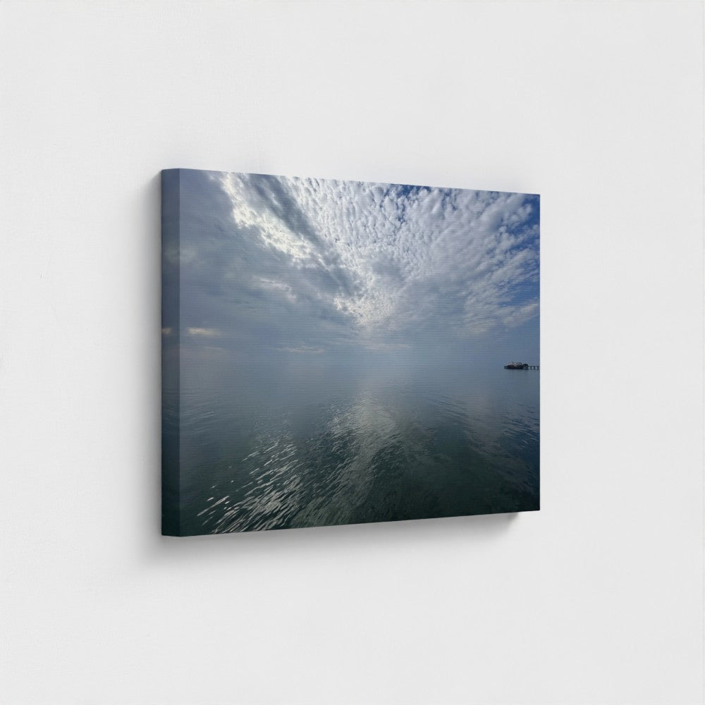 Eco-friendly canvas print of Blackpool seascape with layered clouds, calm water reflections, and a distant pier under a quiet sky.