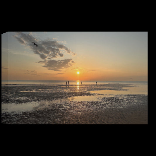Eco-friendly canvas wall art featuring a Blackpool beach sunset with silhouettes of people on reflective wet sand