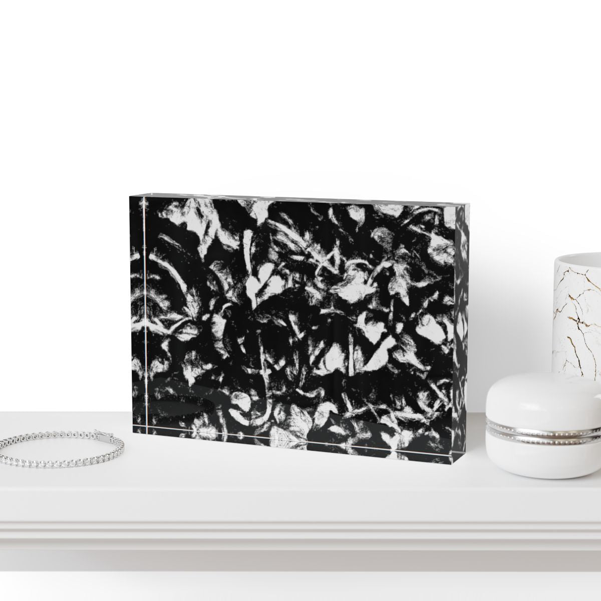 Mockup of block displayed on a minimalist desk with monochrome accessories