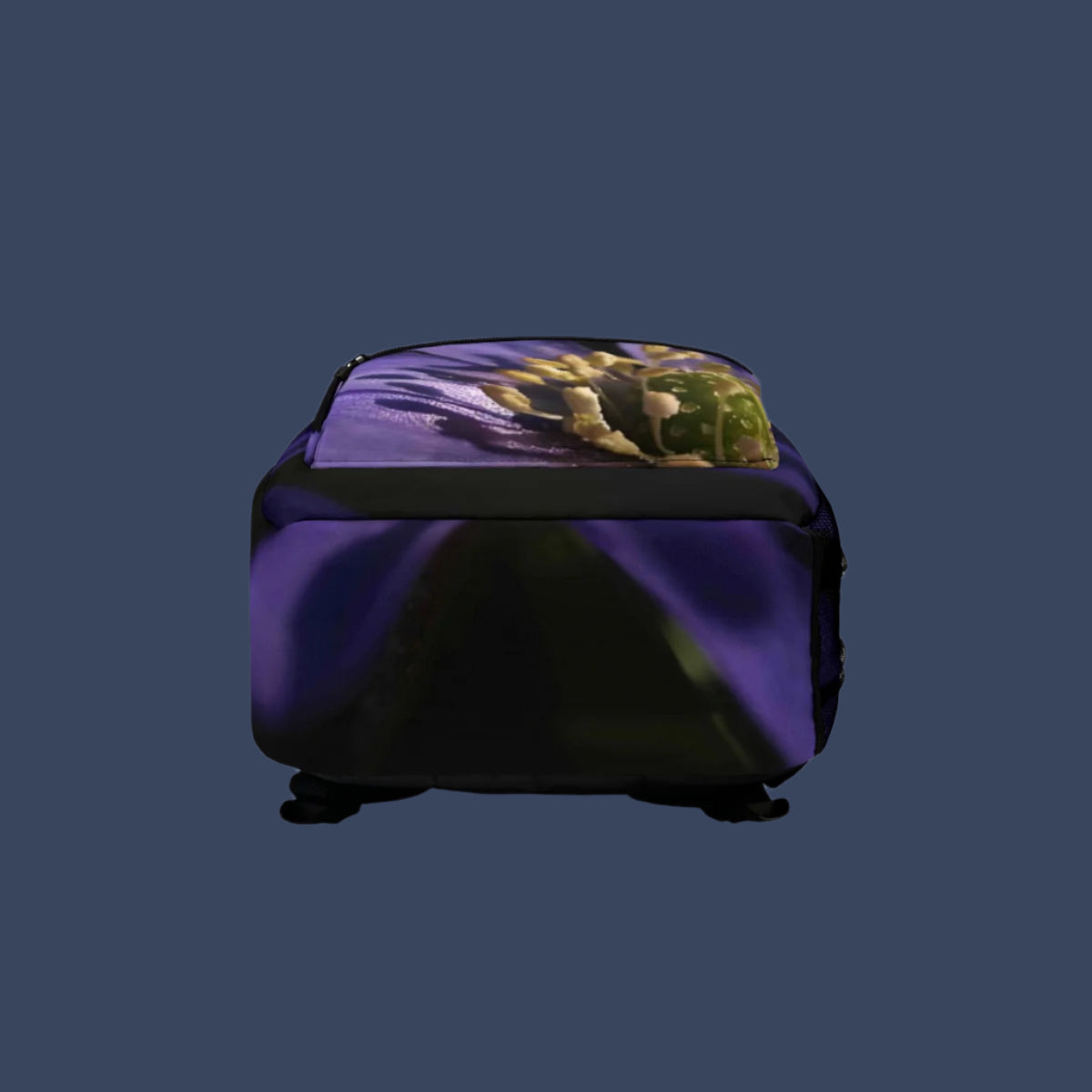 Bottom view of floral backpack featuring rich purple hues and petal textures with reinforced seams.