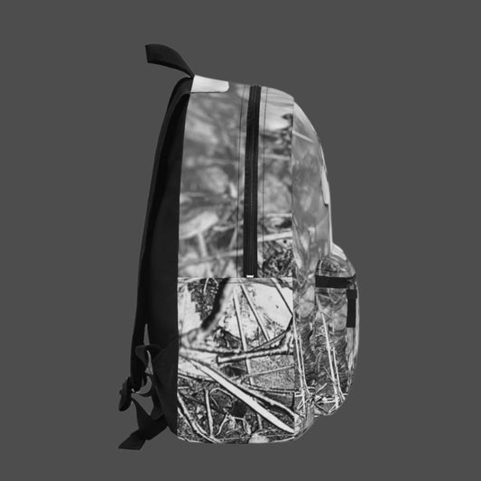 Left side of backpack showing black and white orchid pattern and side bottle pocket.
