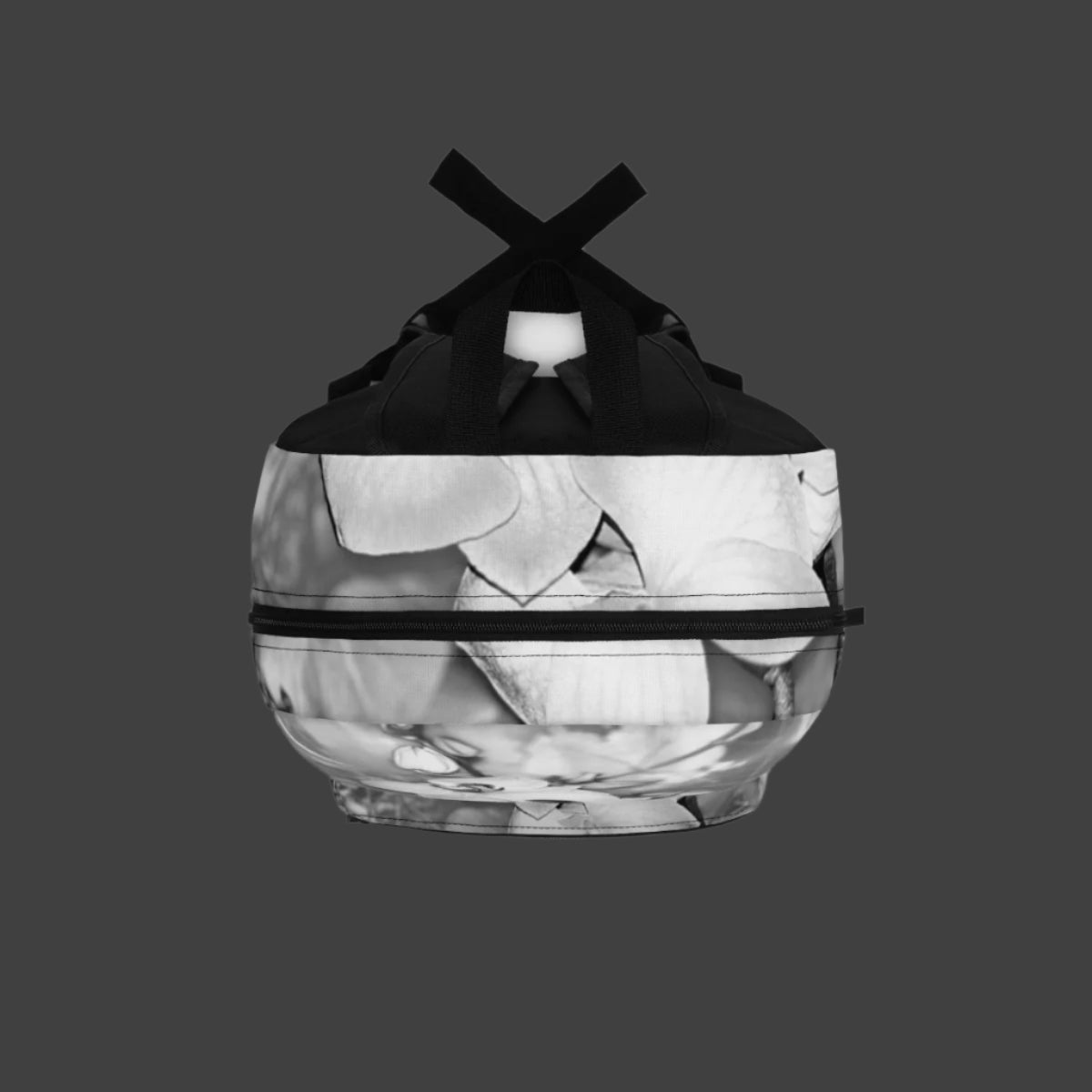 Top-down view of black and white orchid backpack showing handle, zipper openings, and floral design across the top panel.