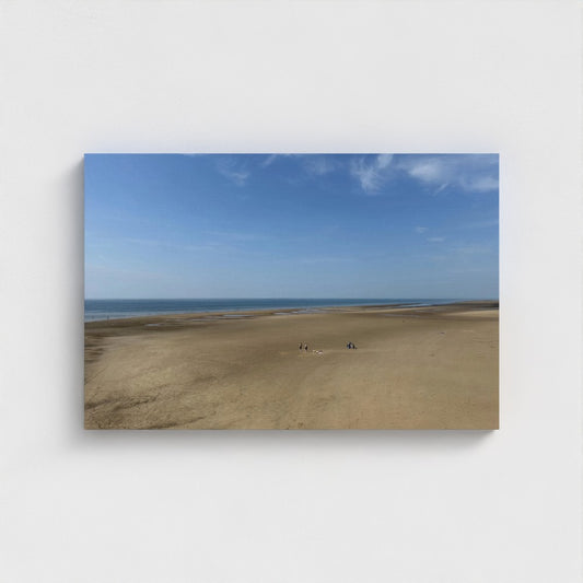 Eco-friendly canvas print of Blackpool Beach with wide sand, small figures in the distance, and a clear blue sky above calm sea