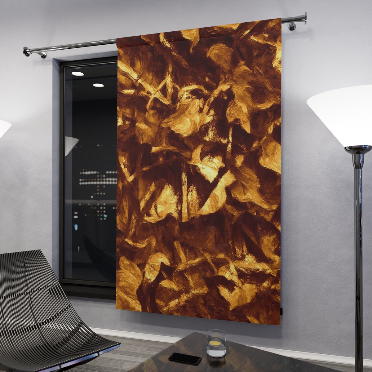 Golden-toned blackout curtain in an evening interior, rich amber and brown foliage textures reflecting soft indoor lighting