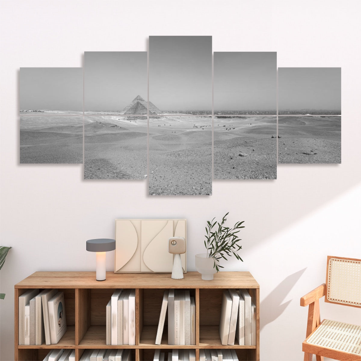 Ten panels mounted in two rows, depicting the same desert and pyramid group in graduated gray tones