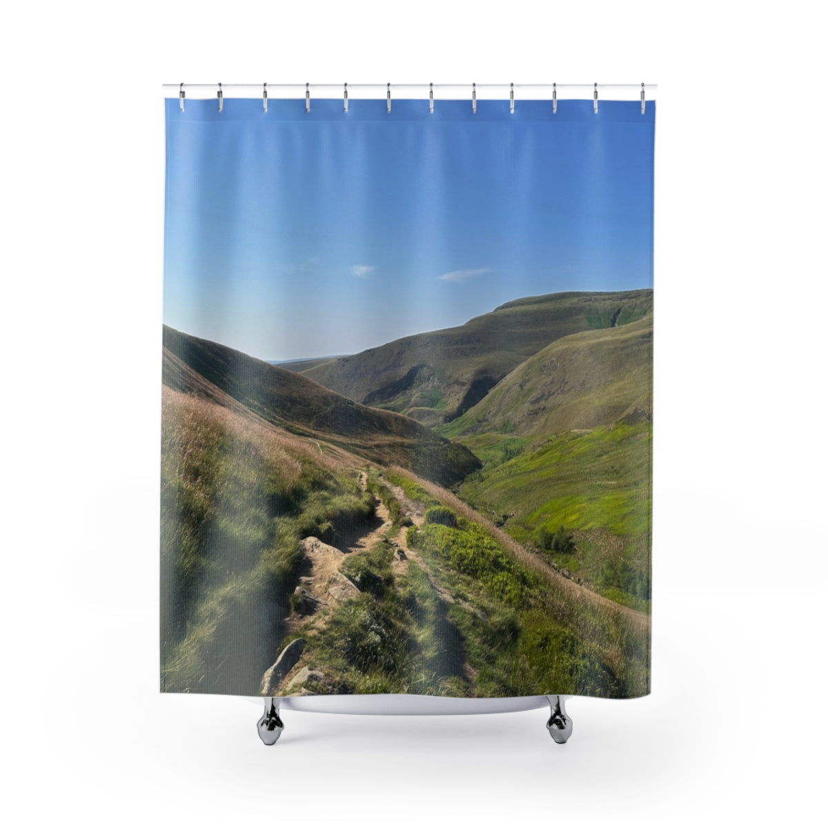 Scenic Highland Trails shower curtain showing a winding path through sunlit green hills against a white background