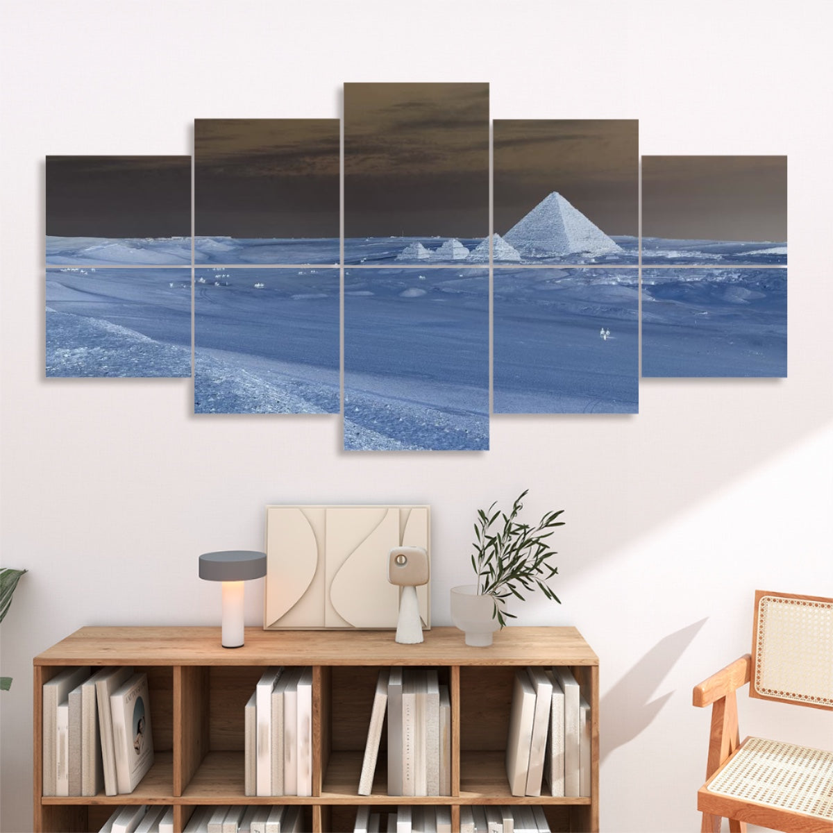 Ten panels showing the pyramid scene in a color-negative palette of dark sky and light sands