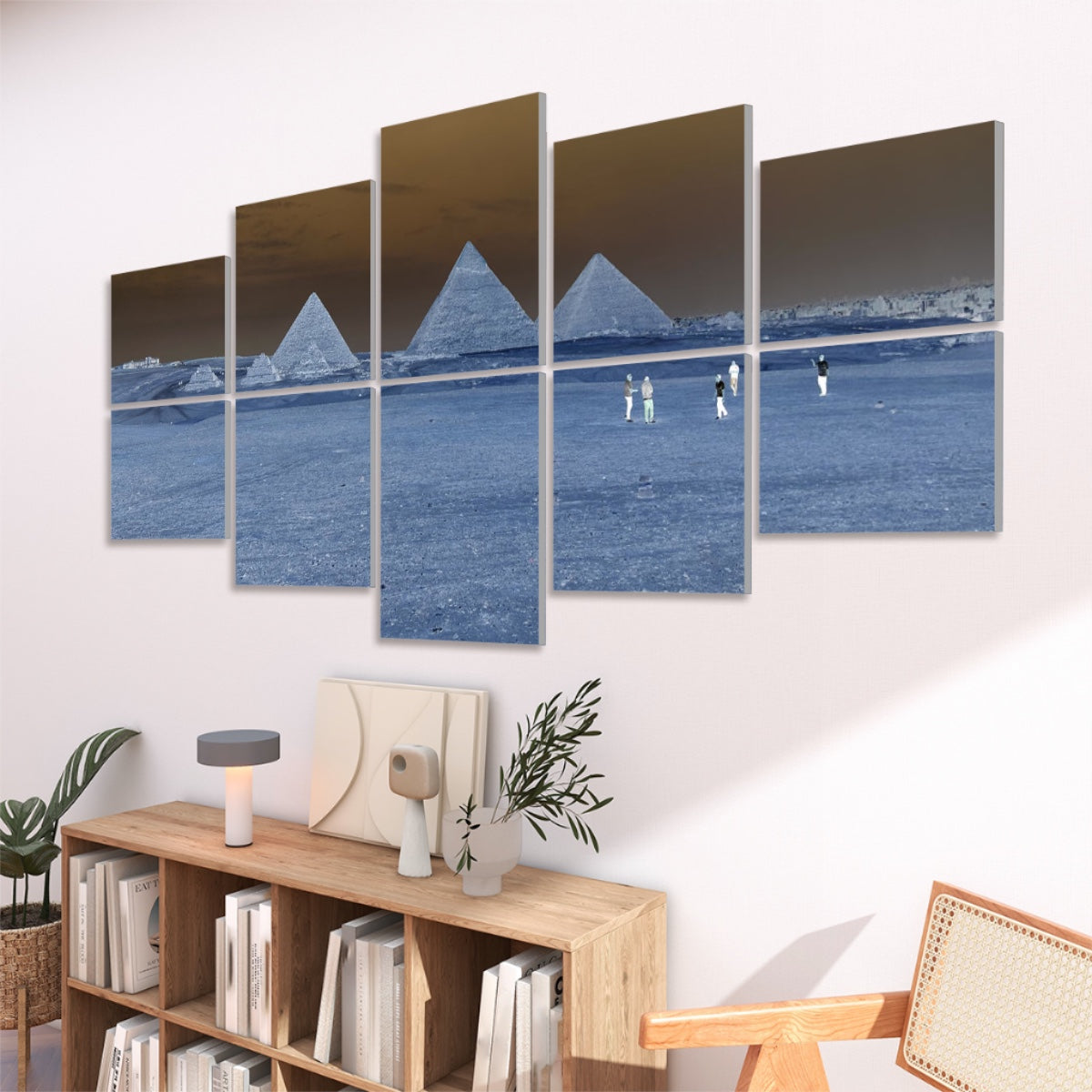 Color-inverted version of the pyramids of Giza and desert foreground with deep blue tones
