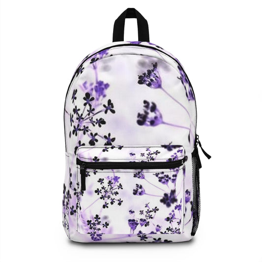 Inverted version of the White Wildflowers backpack featuring a bold black-and-white floral print on the main panel with high contrast.