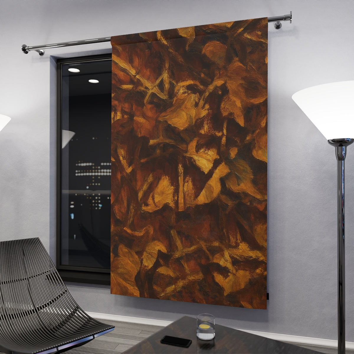 Original variant curtain in brown and gold shades hanging in a modern nighttime interior with dark accents and city lights in the background