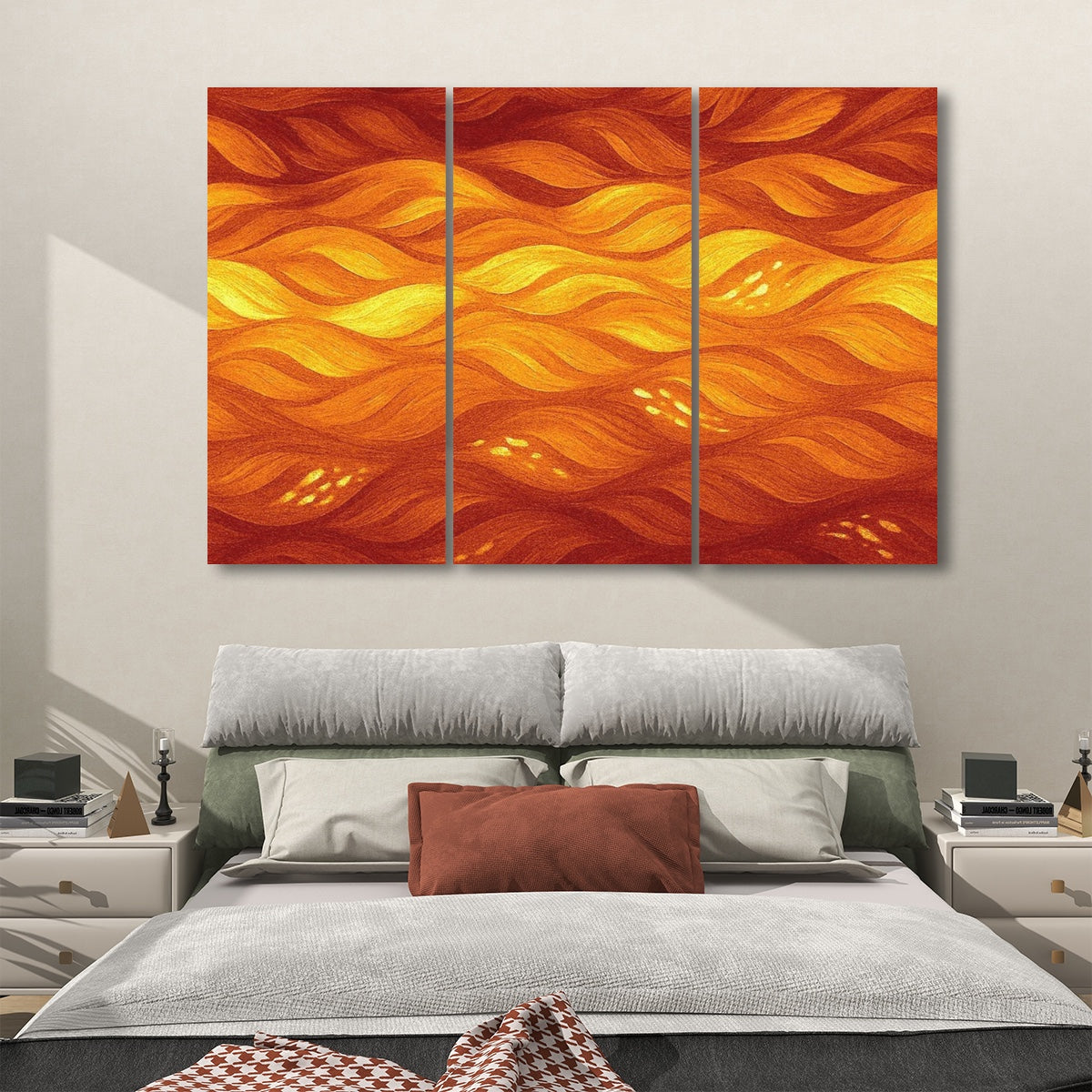 Fiery orange and amber variant with glowing abstract waves across three sound absorbing panels, styled above neutral bedding