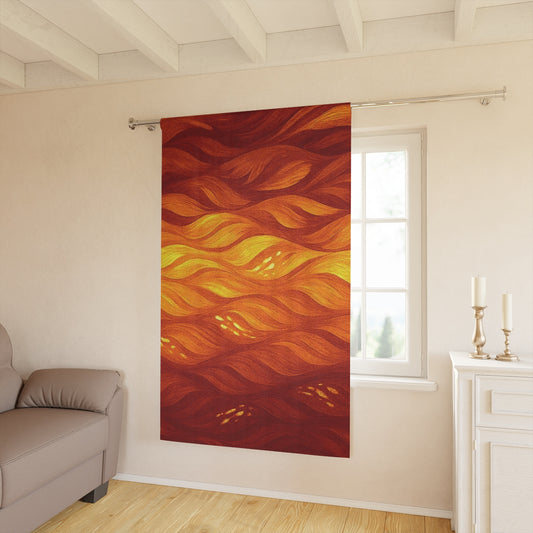 Sunset-inspired blackout curtain with fiery orange and red tones, accented by glowing wave patterns, in a cozy daytime room—50″ × 84″.