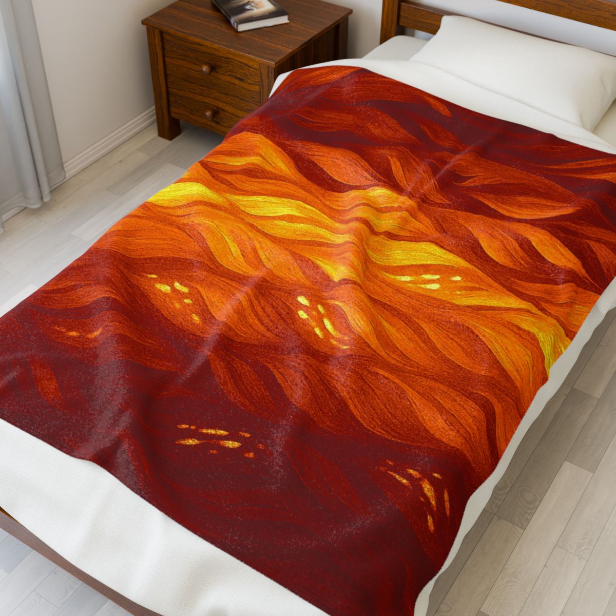 Warm and bold orange–amber throw with red and yellow highlights, draped across a single mattress