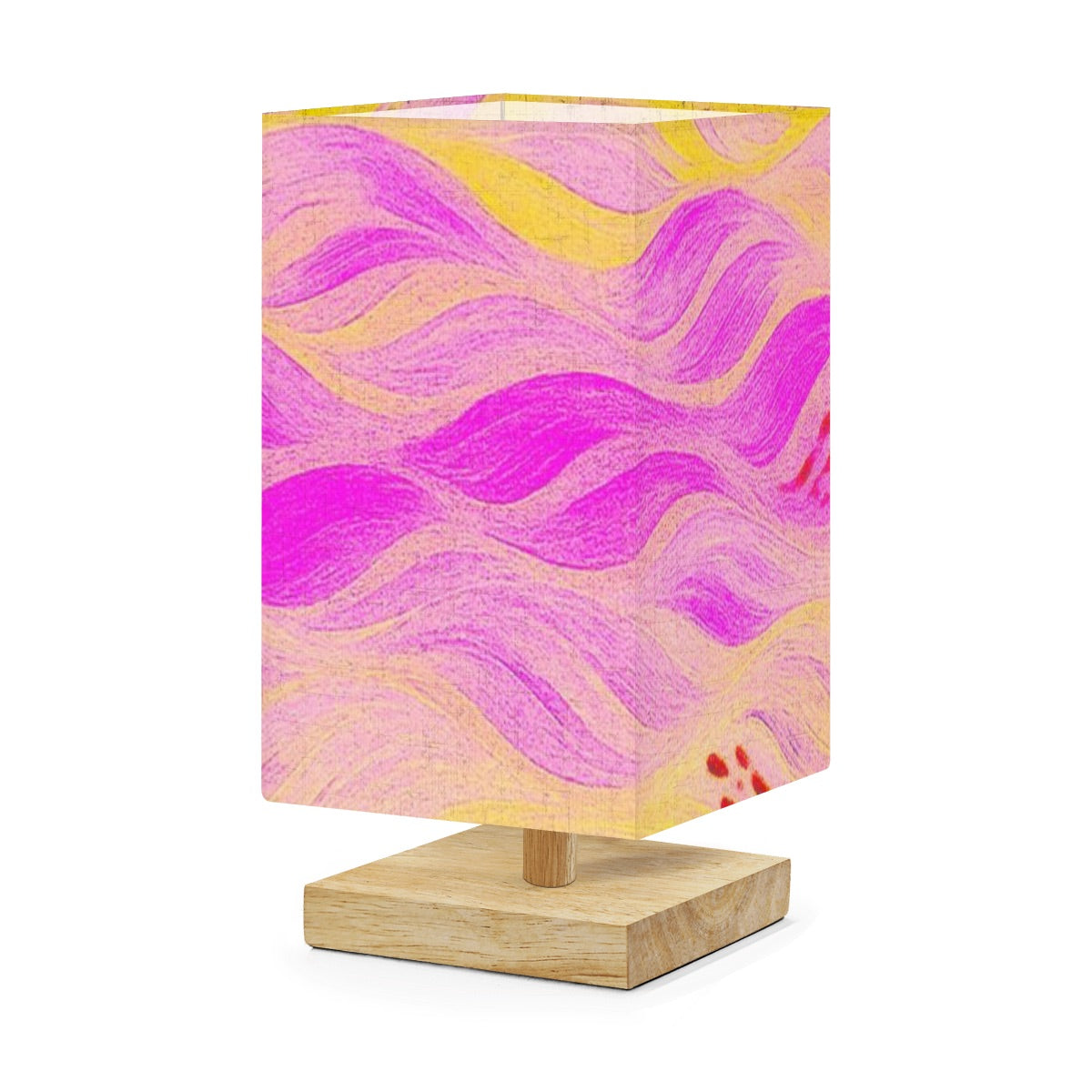 Square table lamp with a linen shade of soft pink flowing currents and gold highlights, atop a rubber wood base.