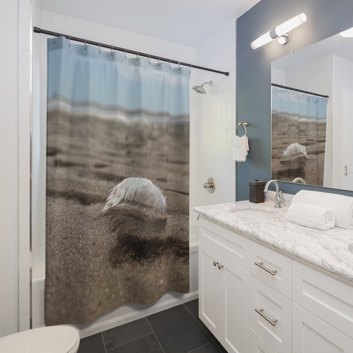 Bathroom vanity mockup with shower curtain hanging on a straight rod depicting a feather on sandy beach with blurred shoreline