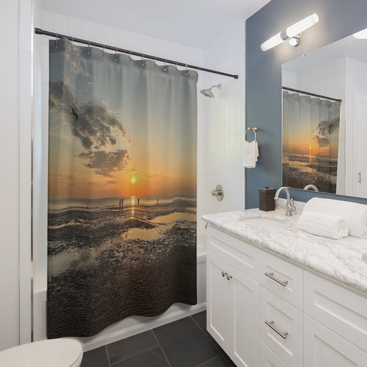 Bathroom mockup with straight rod, showing sunset scene over rippled sand and calm sea next to white vanity