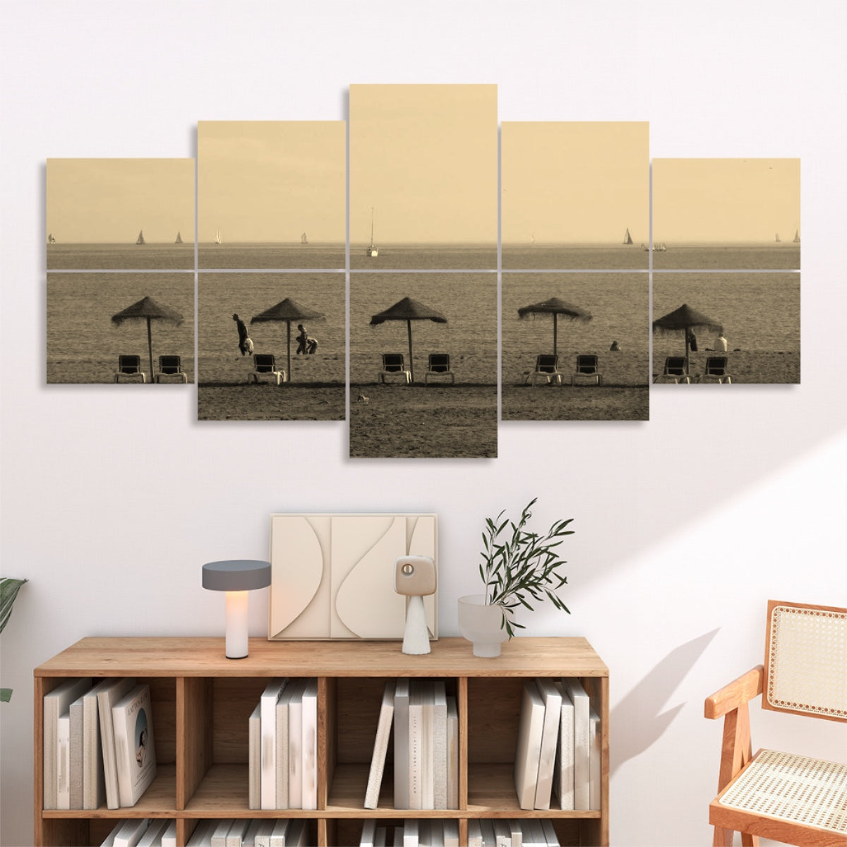 10 panels in sepia tones of a Málaga beach with straw umbrellas lounge chairs and distant sailboats