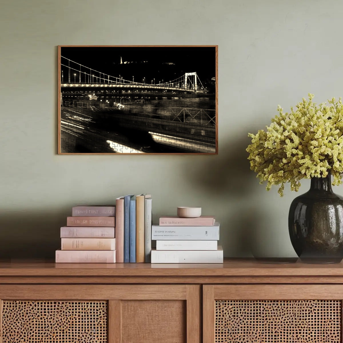 Sepia-toned image of a Budapest bridge and surrounding cityscape, evoking a vintage European mood.