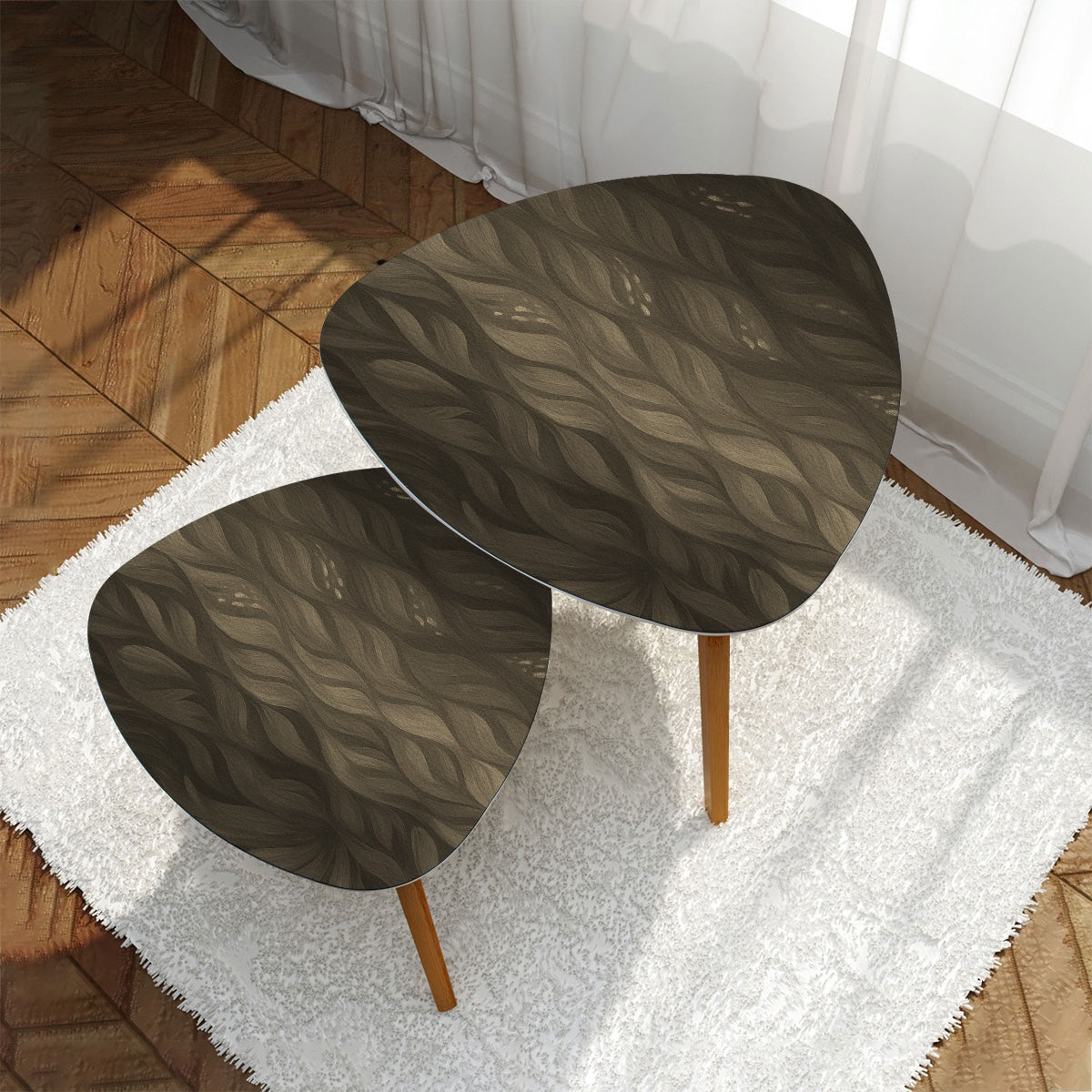 Two nested triangles featuring sepia-tone leather tabletops in brown and tan hues, on a white rug backed by a gray couch; bamboo legs beneath