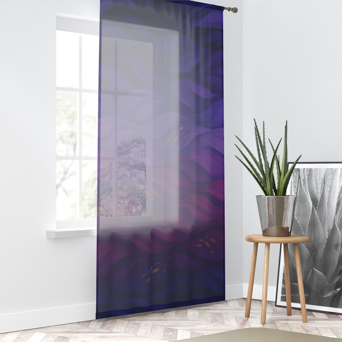 A single sheer curtain in swirling shades of deep purple, magenta, and indigo, with tiny gold accents, hanging before a sunlit window; a wooden stool holding a silver planter with a spiky green succulent stands to the right