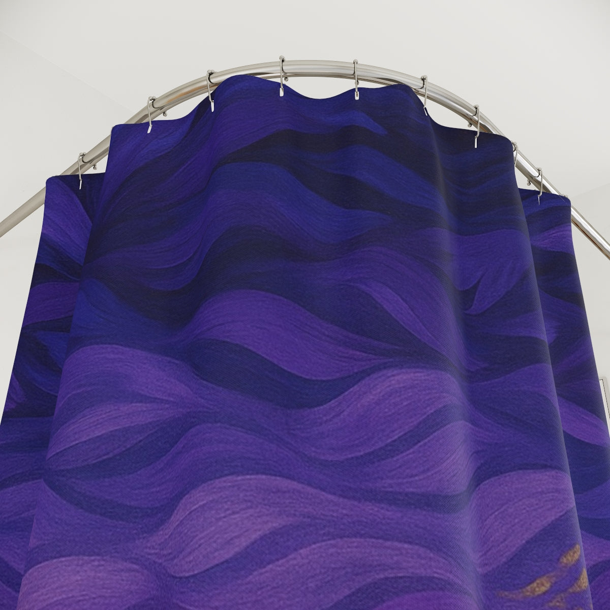 Close-up of fabric showing textured wave shapes in deep purple and violet with tiny gold flecks