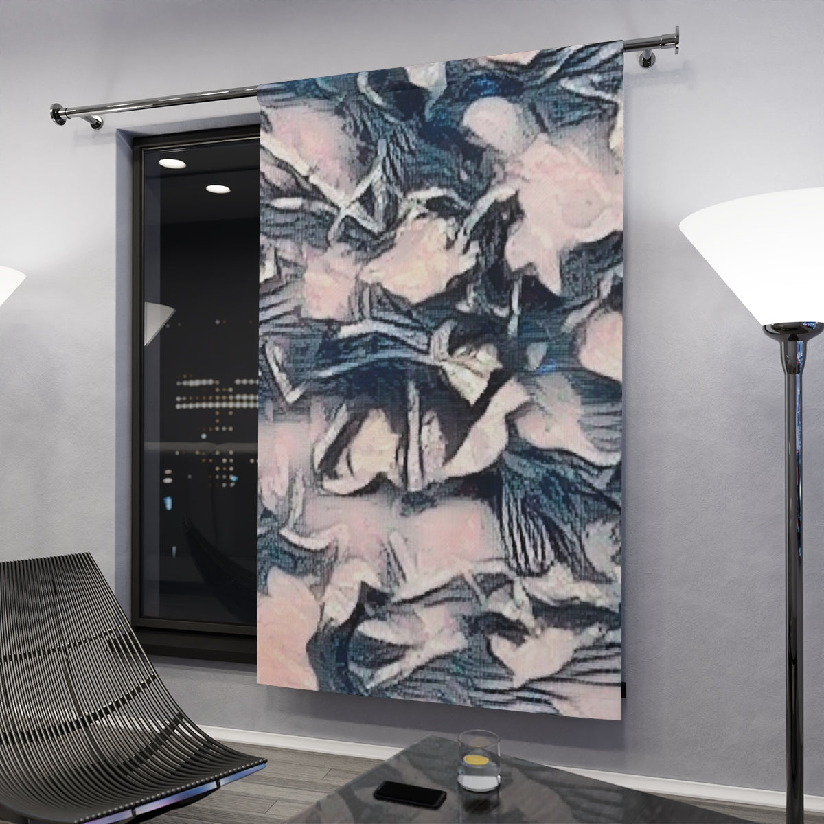 Muted floral abstraction in pale blush and blue-grey tones glowing gently under ambient interior light in a contemporary darkened setting