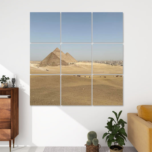 Front view of 9-panel acoustic wall art featuring a wide desert landscape with the Pyramids of Giza in the background and scattered figures in the sand.